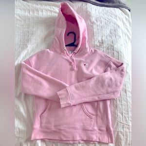 Baby Pink Champion Reverse Weave hoodie.